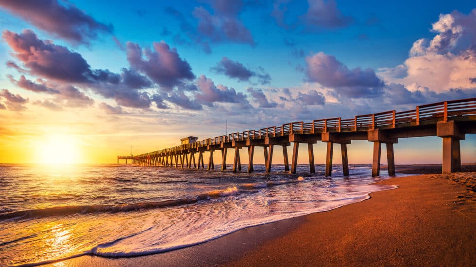 Boardwalk Resort Vacations Reviews features a Clearwater pier at sunset, reflecting the destination’s waterfront atmosphere.
